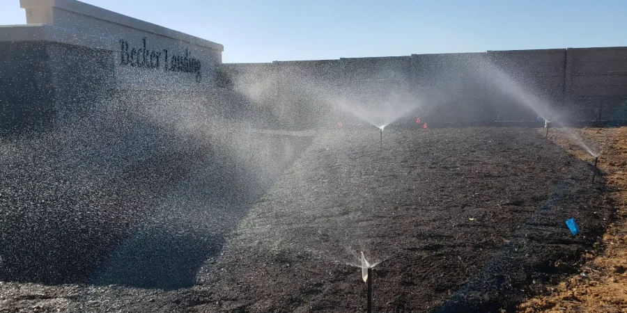 watering in a green landscape with sprinkler system