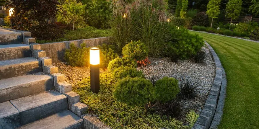 Outdoor garden steps with modern pathway lighting and landscaped greenery at night